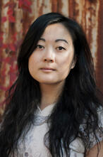 Photo of Jessie Tu looking at camera